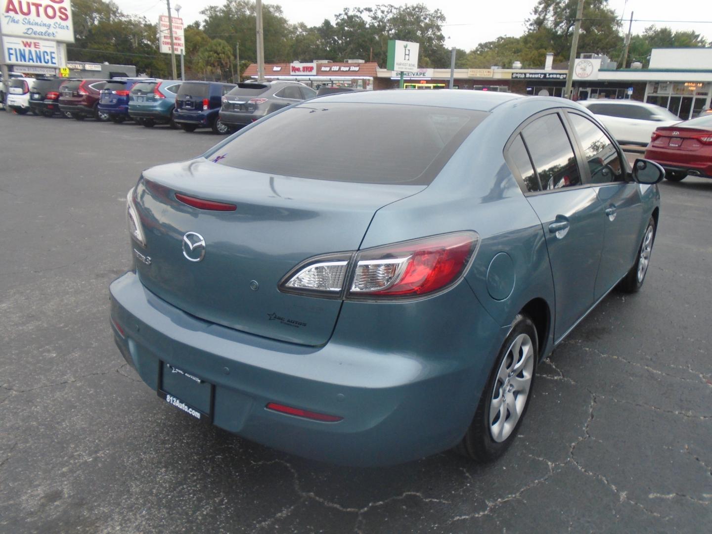 2012 Mazda MAZDA3 (JM1BL1UF0C1) , located at 6112 N Florida Avenue, Tampa, FL, 33604, (888) 521-5131, 27.954929, -82.459534 - Photo#3